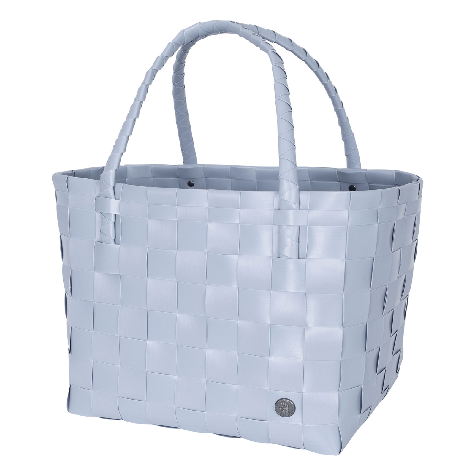 Der Paris Shopper icy mist besteht aus gewebten hellblauen Kunststoffsträngen und hat zwei Henkel zum Tragen.
