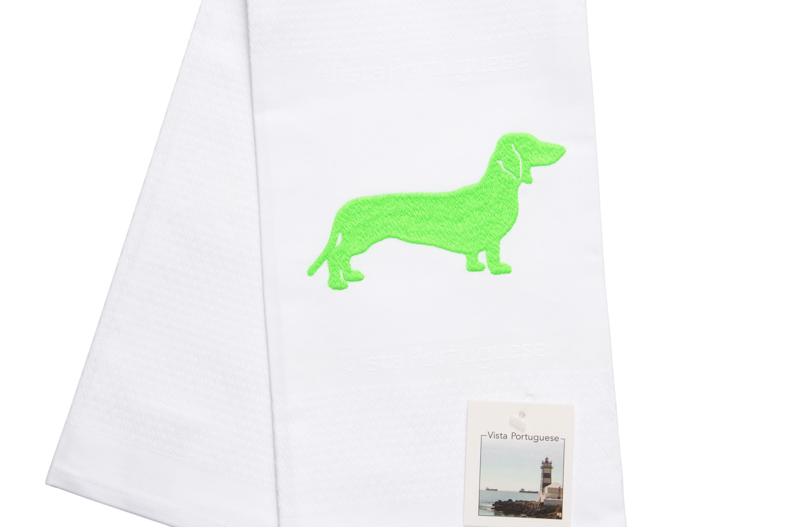 Ausschnitt des Geschirrtuch Dackel 50x70cm Neon Green von Vista Portuguese. Es ist ein weißes Geschirrhandtuch aus Jacquardstoff mit aufgesticktem grünem Dackelmotiv.